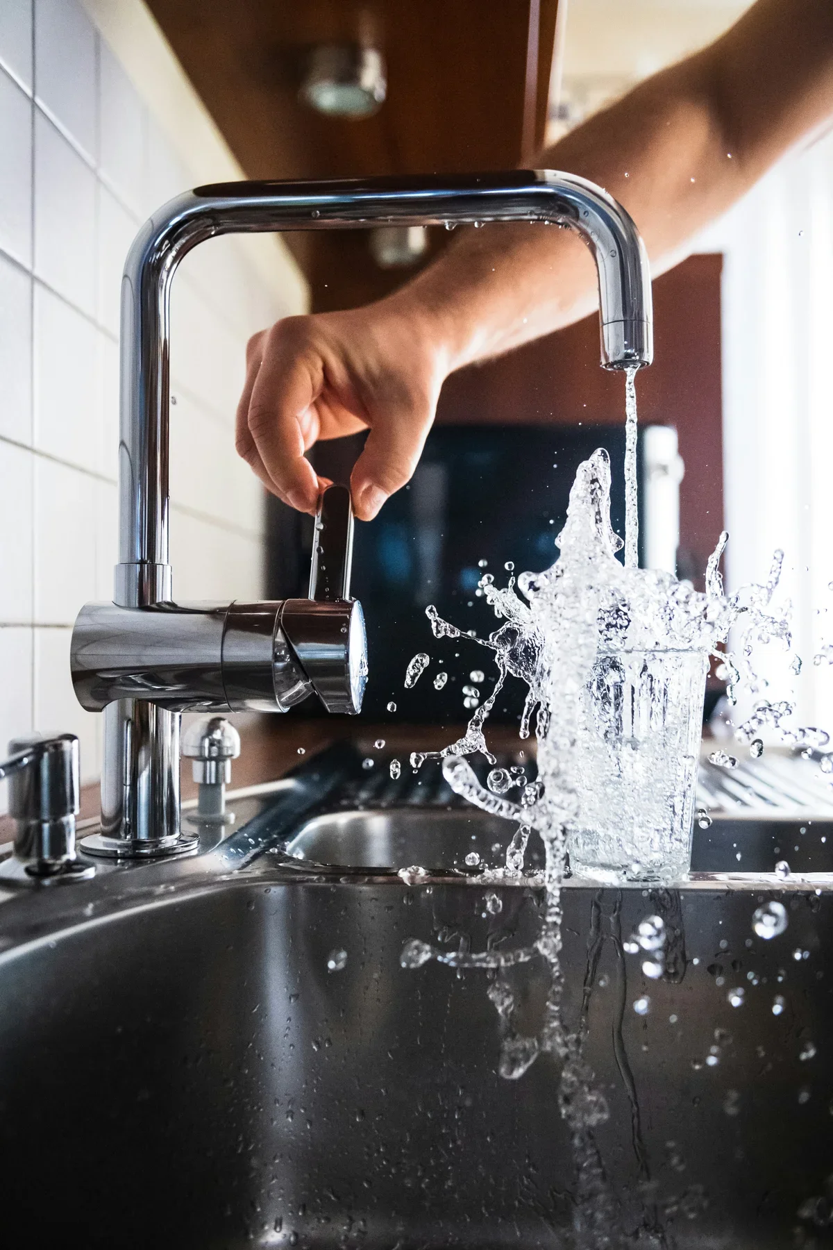 Professional plumber fixing a sink